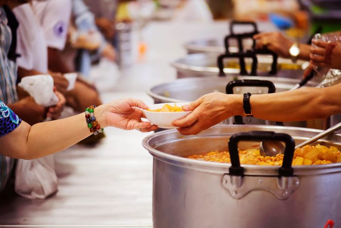 People serving food for people