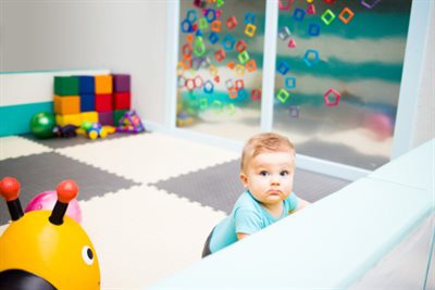 Baby playing in play pen