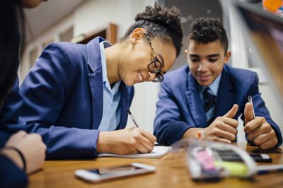 Secondary school students working together