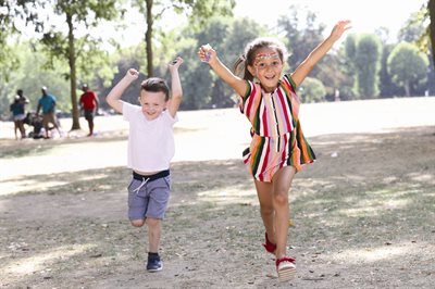 Girl and boy playing in Tower Hamlets Park