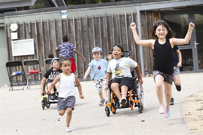 Kids playing and running in a park