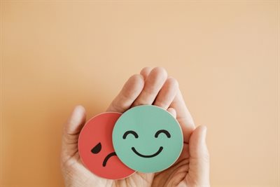 Mental health happy face and sad face