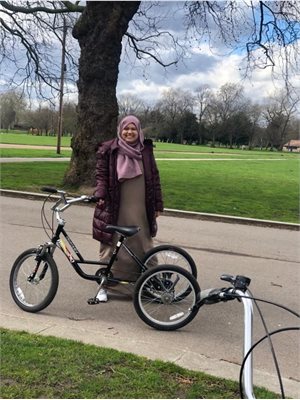 Picture of a women in the park on her bike