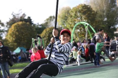 Kid on swing at Millwall Park