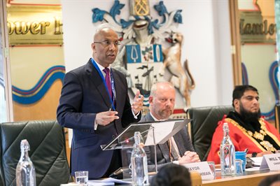 Mayor Lutfur Rahman addresses the May 25 Council AGM next to Council chief executive Will Tuckley and new Speaker Cllr Shafi Ahmed