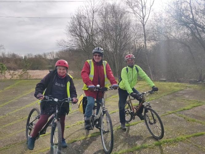 Picture showing a group of friends posing with their bikes