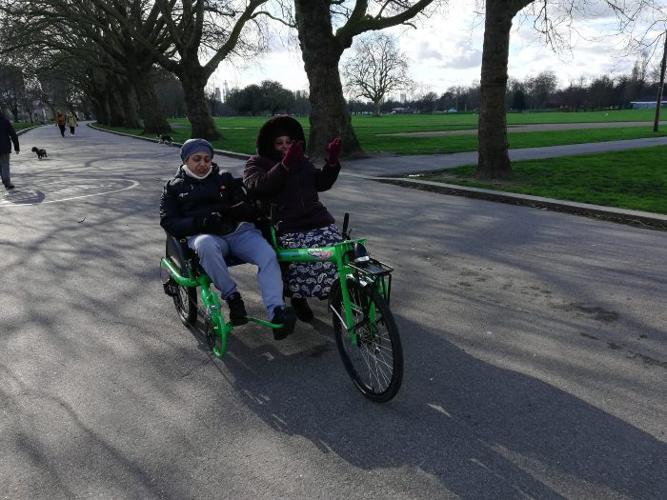 Picture of two women riding a recumbent bicycle