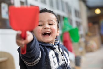 Child playing with spade