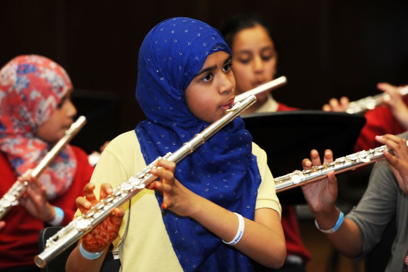 THAMES student playing the flute