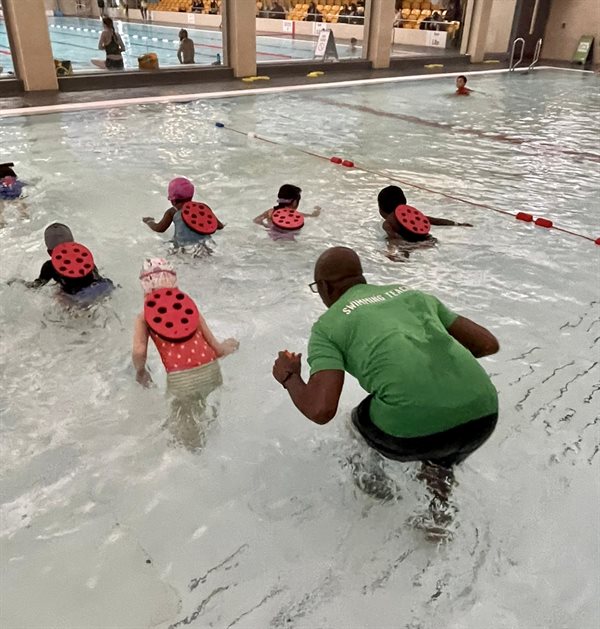 Children and instructor in the pool