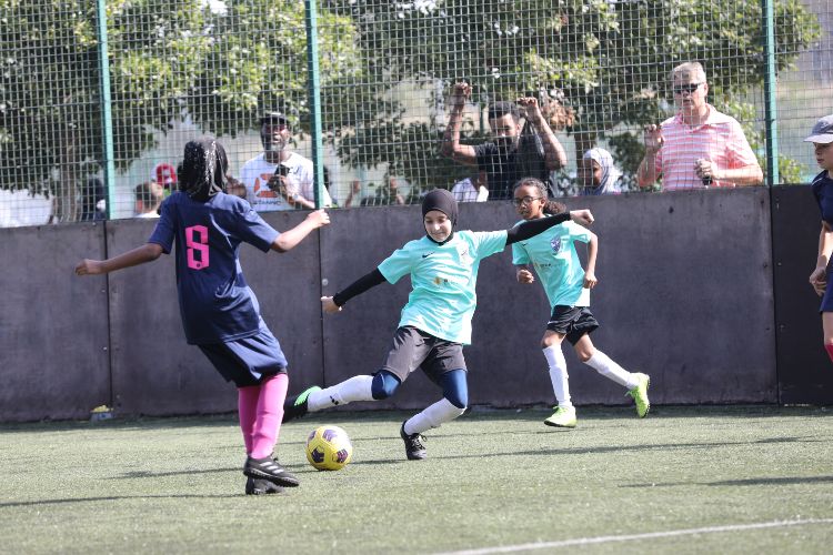 Girls playing football